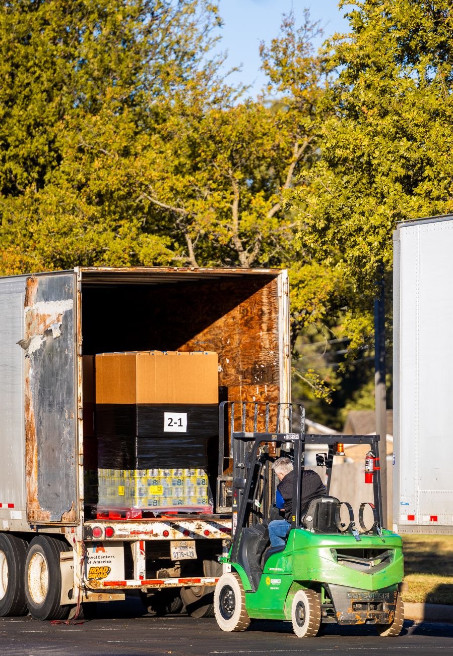 Professional team loading exhibition stands onto transport vehicle